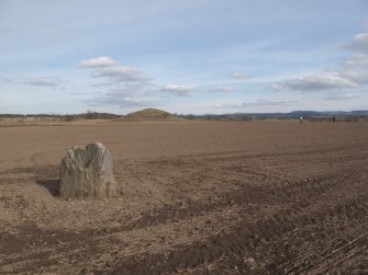 View of Loak standing stone with Court Hill barrow in the background, facing ESE.