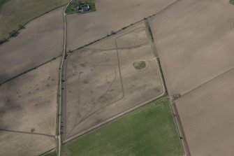 Oblique aerial view of the cairn after tree clearance, looking WSW.