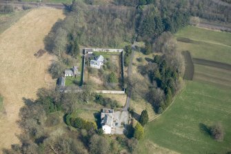 Oblique aerial view of Wyseby House, walled garden, stables and dovecot, looking N.