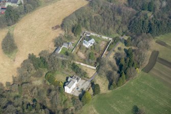 Oblique aerial view of Wyseby House, walled garden, stables and dovecot, looking NNW.