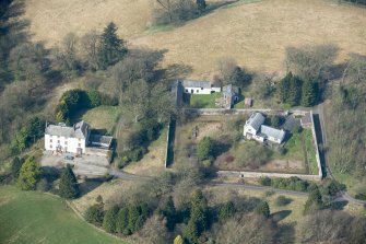 Oblique aerial view of Wyseby House, walled garden, stables and dovecot, looking W.
