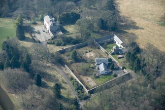 Oblique aerial view of Wyseby House, walled garden, stables and dovecot, looking SW.