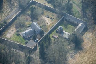 Oblique aerial view of Wyseby stables, walled garden and dovecot, looking S.