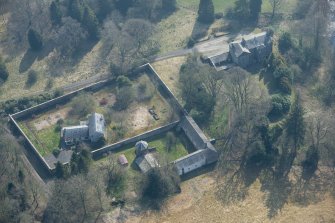 Oblique aerial view of Wyseby House, walled garden, stables and dovecot, looking SE.