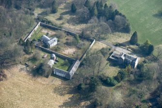 Oblique aerial view of Wyseby House, walled garden, stables and dovecot, looking E.