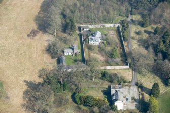 Oblique aerial view of Wyseby House, walled garden, stables and dovecot, looking N.