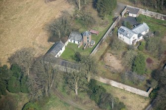 Oblique aerial view of Wyseby stables, walled garden and dovecot, looking NNW.