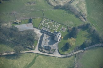 Oblique aerial view of Buittle Place Tower House, looking ESE.