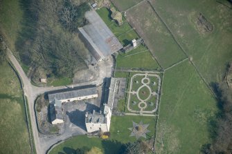 Oblique aerial view of Buittle Place Tower House, looking NNE.