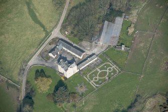 Oblique aerial view of Buittle Place Tower House, looking N.