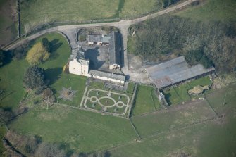 Oblique aerial view of Buittle Place Tower House, looking WNW.