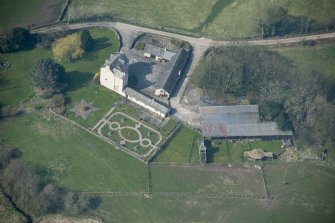 Oblique aerial view of Buittle Place Tower House, looking W.