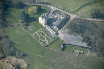 Oblique aerial view of Buittle Place Tower House, looking WSW.