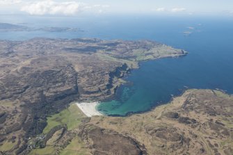 General oblique aerial view of Calgary Bay on the Isle of Mull with Treshnish beyond, looking SW.