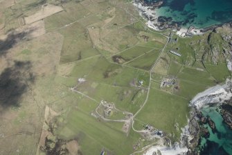 General oblique aerial view of Hynish on Tiree, looking NNE.