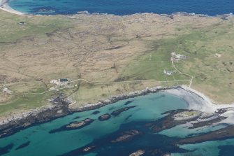 General oblique aerial view of Crossapol with Traigh Halum beyond, Isle of Tiree, looking NW.