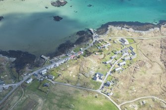 Oblique aerial view of Arinagour on the Isle of Coll, looking E.