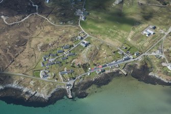 Oblique aerial view of Arinagour on the Isle of Coll, looking WSW.