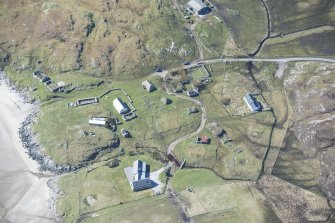 Oblique aerial view of Sorisdale on the Isle of Coll, looking SW.