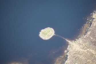 Oblique aerial view of Dun Anlaimh on the Isle of Coll, looking NNW.