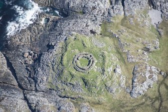 Oblique aerial view of Dun Mor, Vaul, on the Isle of Tiree, looking NE.