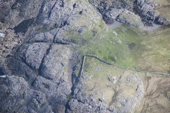Oblique aerial view of Dun Boraige Moire on the Isle of Tiree, looking ENE.