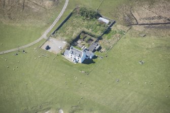 Oblique aerial view of Glebe House at Gott on the Isle of Tiree, looking WSW.
