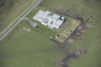 Oblique aerial view of an operations block at Baugh on the Isle of Tiree, looking NW.