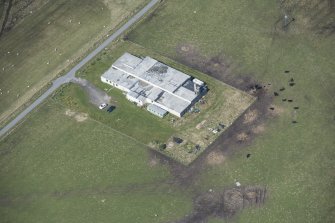 Oblique aerial view of an operations block at Baugh on the Isle of Tiree, looking NW.