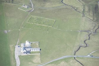 Oblique aerial view of Kirkapol old parish church and cemeteries on the Isle of Tiree, looking NW.