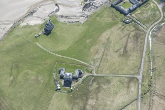 Oblique aerial view of Breachacha House and castle on the Isle of Coll, looking SSE.