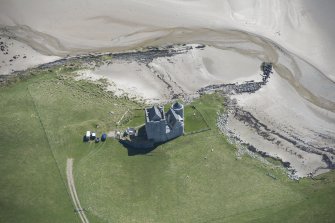 Oblique aerial view of Breachacha Castle on the Isle of Coll, looking ESE.