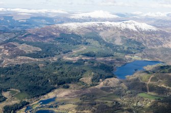 General oblique aerial view of the Black Water and Loch Achray with Ben Venue beyond, looking SW.