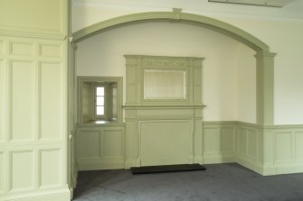 Level 6, south west corner room, view of fireplace in arched recess