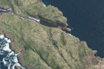 Oblique aerial view of the New Lighthouse, Lighthouse and Keepers Cottage, Jetty and Port War Signal Station on the Isle of May, looking SW.