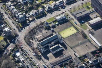 Oblique aerial view of St John's RC Primary School, looking S.