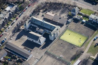 Oblique aerial view of St John's RC Primary School, looking SE.