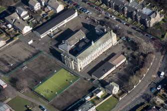 Oblique aerial view of St John's RC Primary School, looking NE.