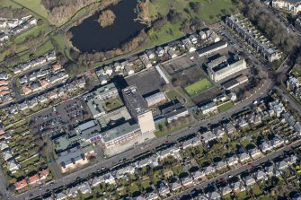Oblique aerial view of Portobello High School and St John's RC Primary School, looking NNE.