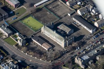 Oblique aerial view of St John's RC Primary School, looking WNW.