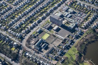 Oblique aerial view of Portobello High School and St John's RC Primary School, looking SW.