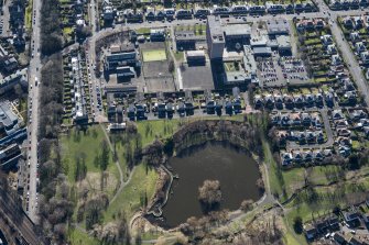 Oblique aerial view of Portobello High School, St John's RC Primary School and Figgate Burn Park, looking SSE.