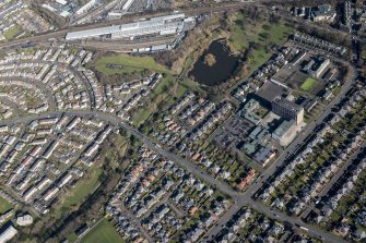 Oblique aerial view of Portobello High School, St John's RC Primary School and Figgate Burn Park, looking NE.