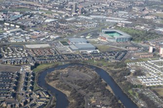 Oblique aerial view of The Glasgow Commonwealth Games Village, Emirates Arena and Celtic Park, looking N.