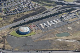 Oblique aerial view of Provan Gasworks, looking SSE.