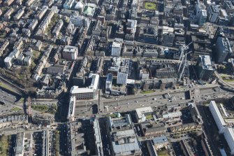 Oblique aerial view of the west end of Glasgow City Centre, Sauchiehall Street, Garnethill and Charing Cross, looking E.