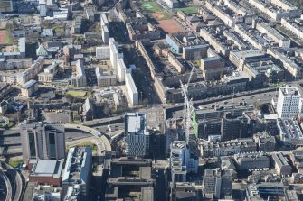 Oblique aerial view of the M8 at the junction of St Vincent Street and St Patrick's Roman Catholic Church, looking W.