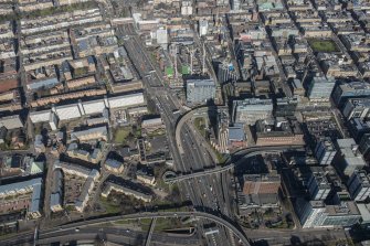 Oblique aerial view of Charing Cross and the M8 at the junction of St Vincent Street, looking N.