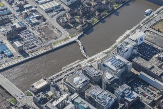 Oblique aerial view of Tradeston Footbridge, looking SW.