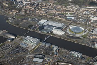Oblique aerial view of Scottish Exhibition and Conference Centre, BBC Broadcasting Studio, The Hydro and  Millenium Bridge, looking NNW.